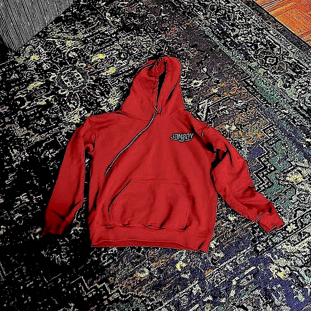 Burgundy pullover hoodie sweatshirt with "Jomboy Media" embroidered in blue